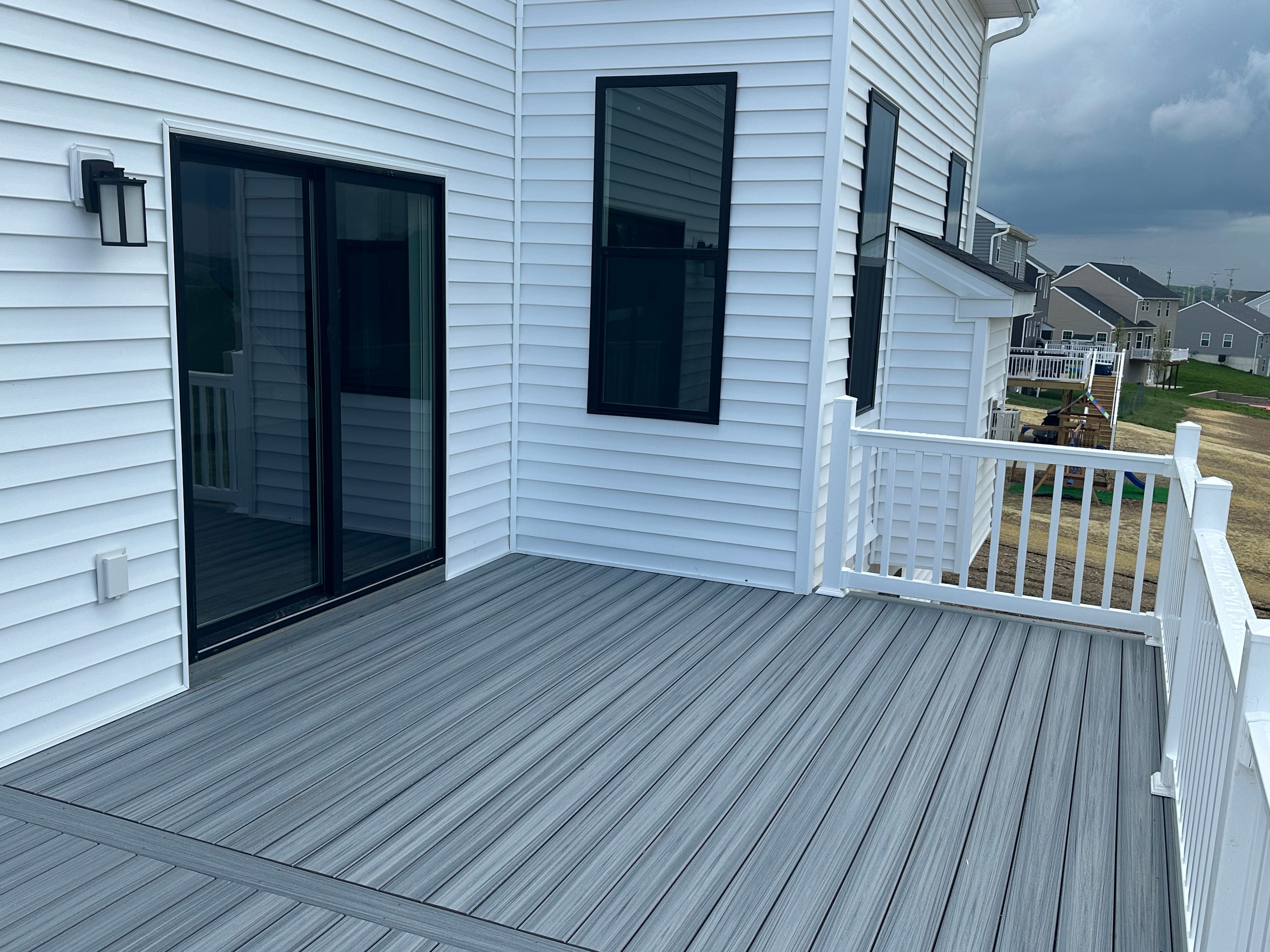 Finished deck with white railings